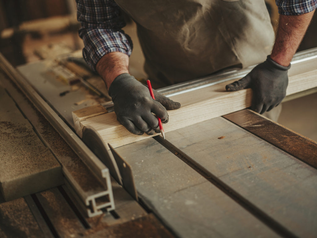 carpenter at work with woodworking tools